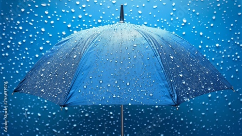 A blue umbrella with rain drops