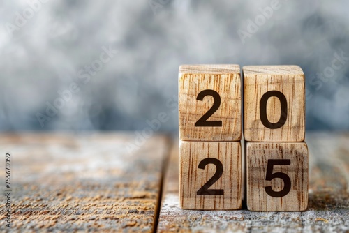 Wooden blocks written the year 2025.