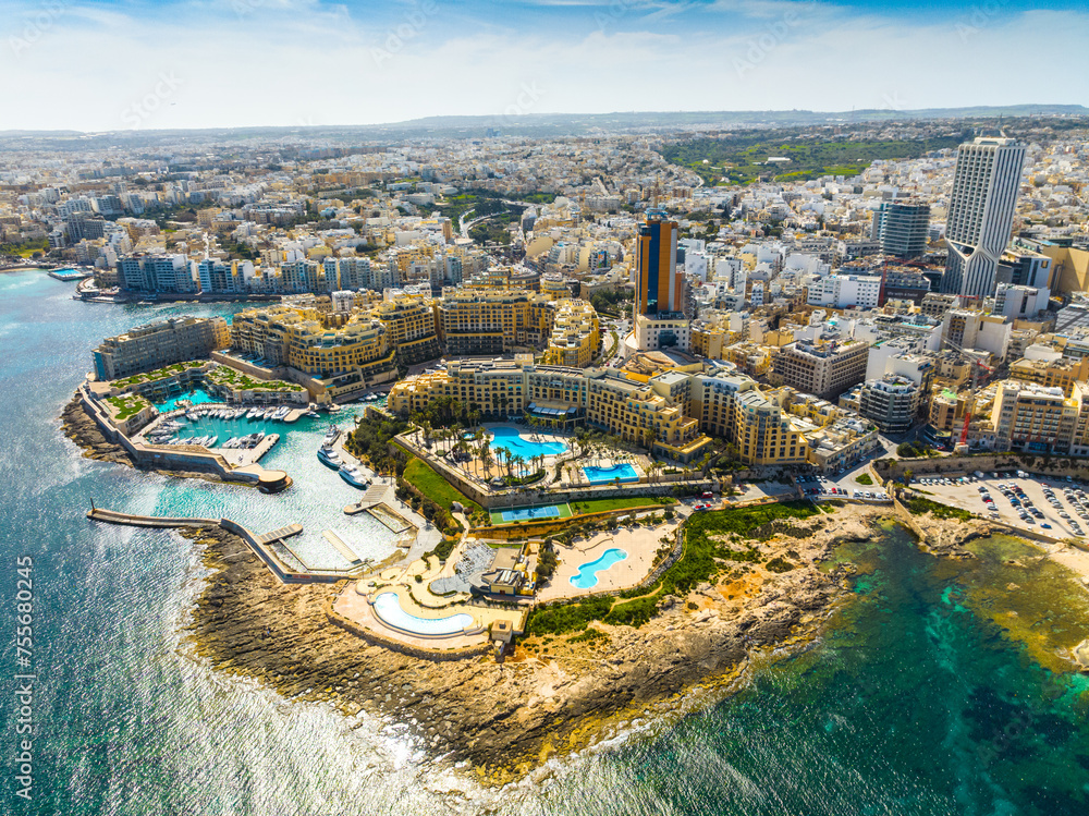 Obraz premium Aerial drone view of St. Julian's city, modern high buildings. Day. Maltese island, Mediterranean sea