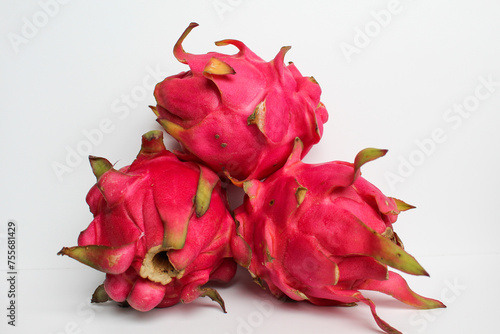 Red pitaya fruits. Three fresh dragon fruit, isolated on white background