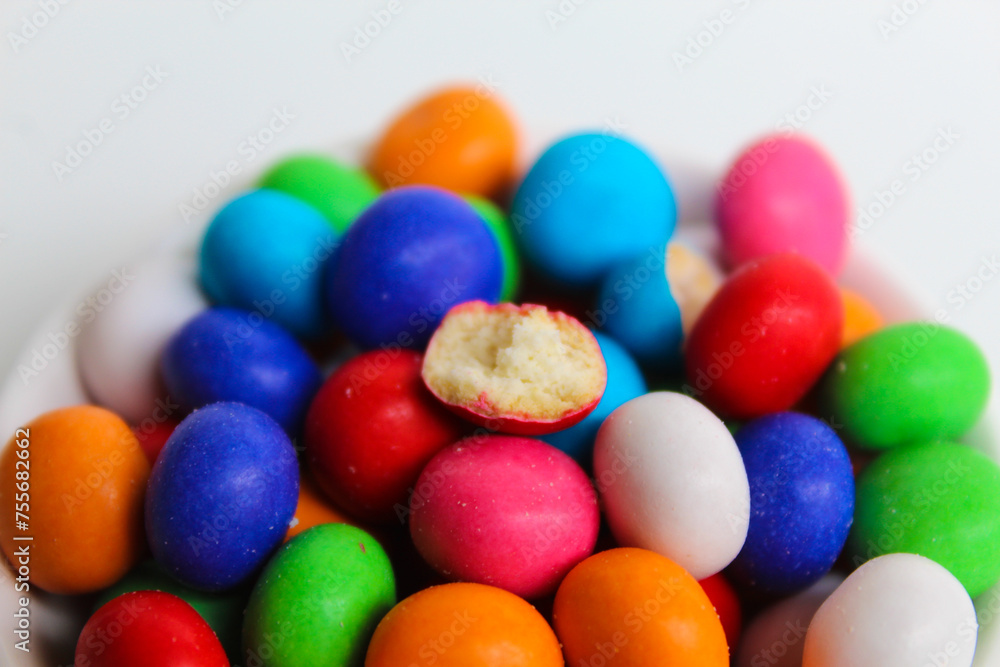 Biscuit balls coated by colorful chocolate. Isolated on white background Biscuit balls coated by colorful chocolate. Isolated on white background