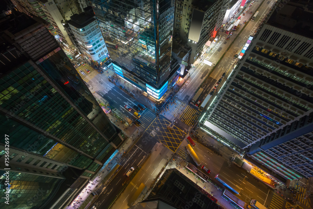 Skyscrapers and road at night in Hong Kong city, China, top view Skyscrapers and road at night in Hong Kong city, China, top view