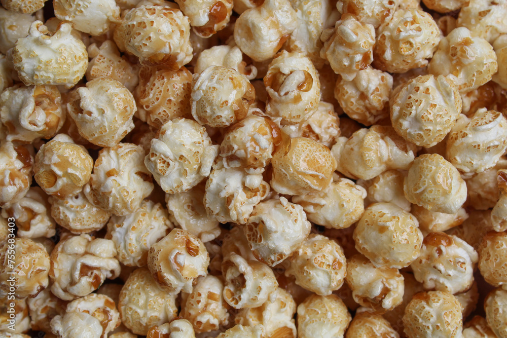 Background texture of caramel popcorn. Popcorns coated by melted sugar Background texture of caramel popcorn. Popcorns coated by melted sugar