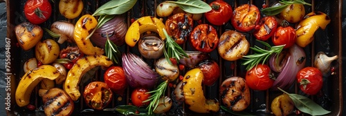 A rustic picnic spread with various grilled vegetables on a wooden table. photo