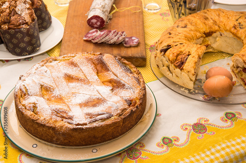 Bilde på lerret Easter Breakfast whit Colomba Pasquale or Easter Dove,  eggs, pastiera napoletana, corallina salami and casattiello cake from Napoli Italy