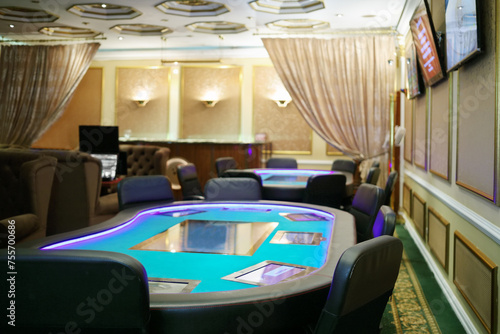 Empty casino with modern electronic poker tables and beautiful curtains