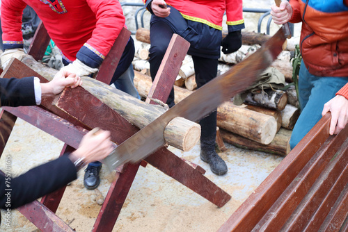 Εκτύπωση καμβά Hands of two men sawn timber at national fair outdoor, noface
