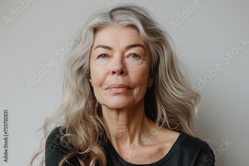 Beautiful gorgeous 50s mid aged mature woman looking at camera isolated on white. Mature old lady close up portrait. Healthy face skin care beauty. middle age skincare cosmetics. cosmetology concept.