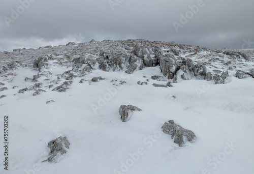 Velino Sirente Park, Italy - The suggestive mountain natural park in Abruzzo region with snow during the winter. Here in particular the Monte Cava (2000 meters) with alpinists. photo