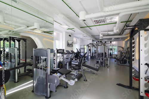 Empty modern gym with new shiny fitness equipment for sport training