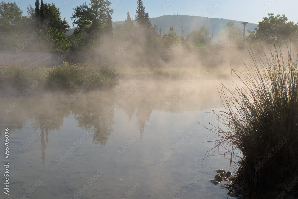 Early morning fog over hot volcanic mineral springs creates an ideal setting for tranquil solitude, fostering internal harmony.