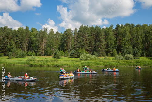  Tourists on boats on river. Tvertsa - river in Tver region of Russia. Length - 188 km. The river is used by tourists for canoeing