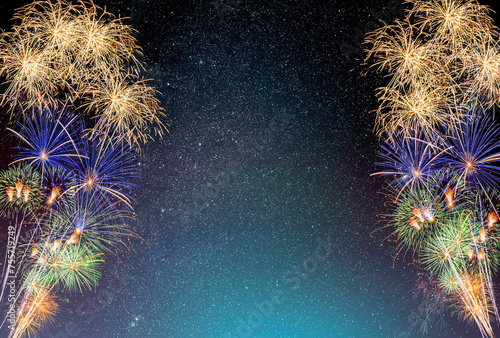 Fireworks display on milkyway sky background.