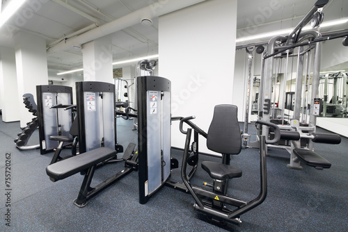 Fitness center with sport equipment for chest press and seated row