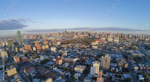 Cityscape with Dutch Kills quarter, Queensboro Bridge and Manhattan skyscrapers at summer evening. Aerial view photo