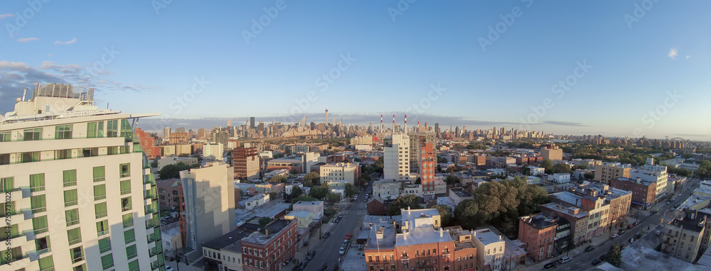 Cityscape with Dutch Kills district, Queensboro Bridge and Manhattan skyscrapers at summer evening. Aerial panorama