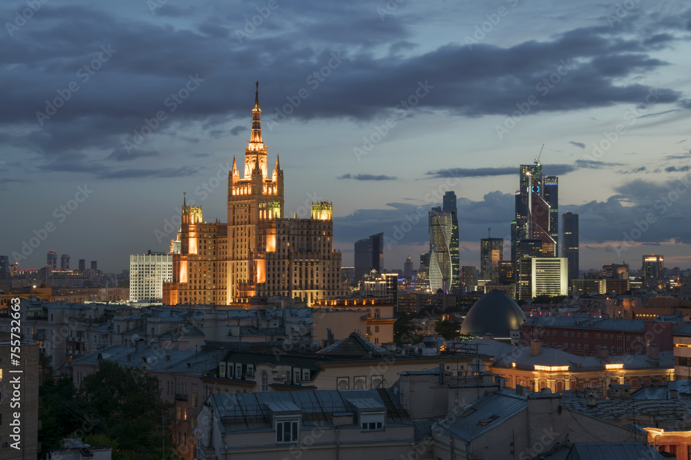 Fototapeta premium Residential building on square Kudrinskaya (Stalin skyscraper) at night in Moscow, Russia