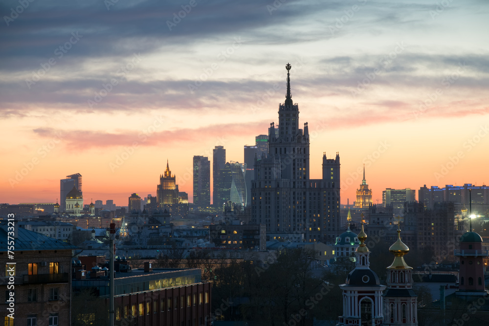 Panorama of churches, Stalin skyscraper and skyscrapers at sunset in Moscow, Russia