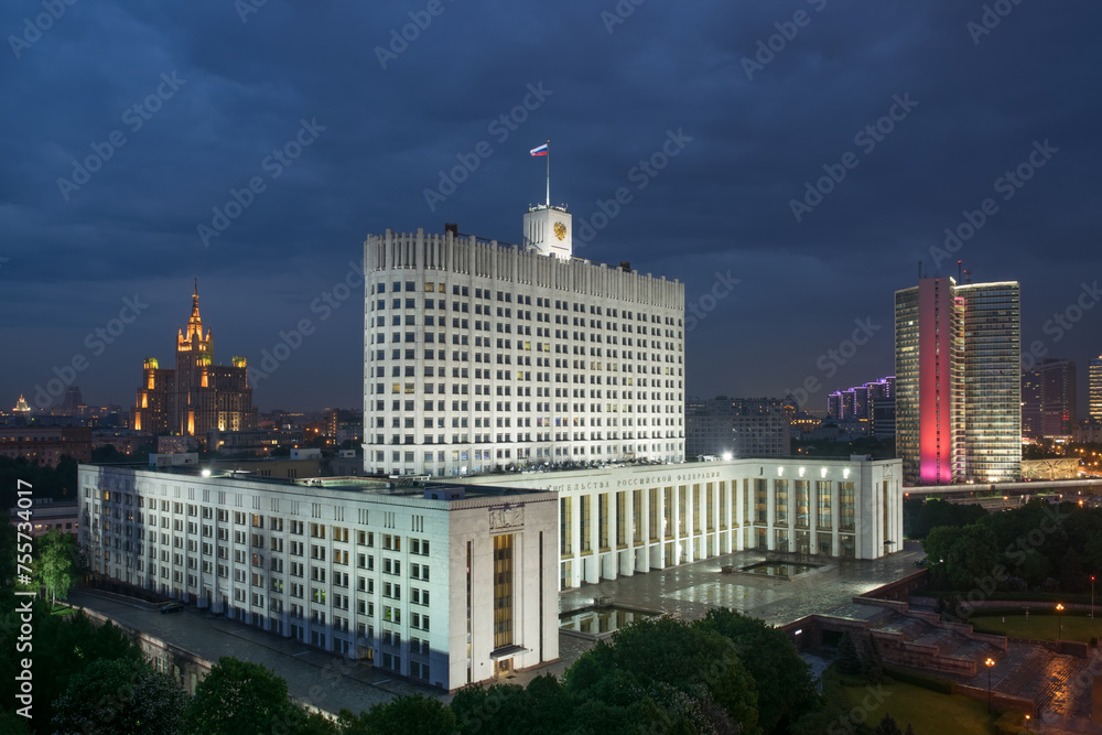 Russian Federation government building with flag at night in Moscow, Russia