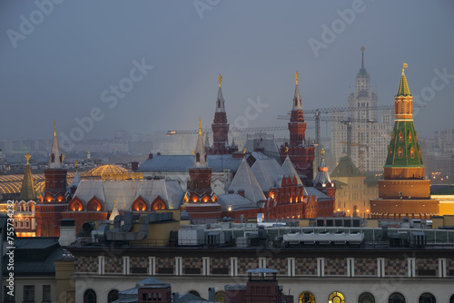 Roof of historical museum and Kremlin Tower with illimination at night in Moscow, Russia