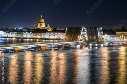 Diluted Palace Bridge, St. Isaac Cathedral at night in St. Petersburg, Russia