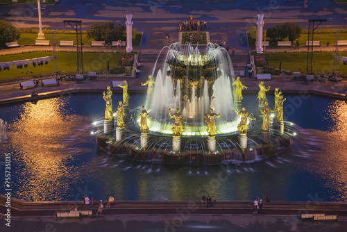 Beautiful Fountain Friendship Of Nations with illumination in VDNKh at night in Moscow, Russia