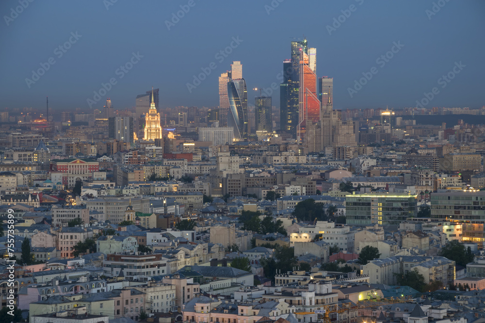 Residential buildings, roofs and skyscrapers at summer morning in Moscow, Russia