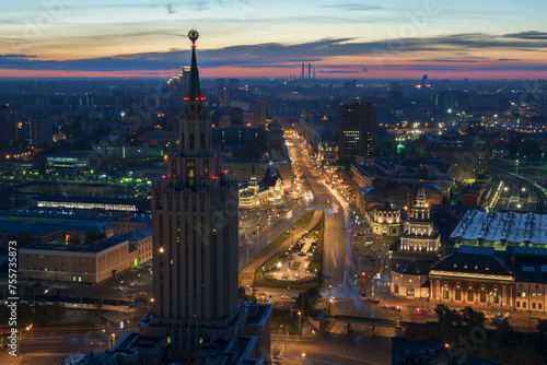 Stalin skyscraper on Komsomolskaya square and city road at early morning in Moscow photo