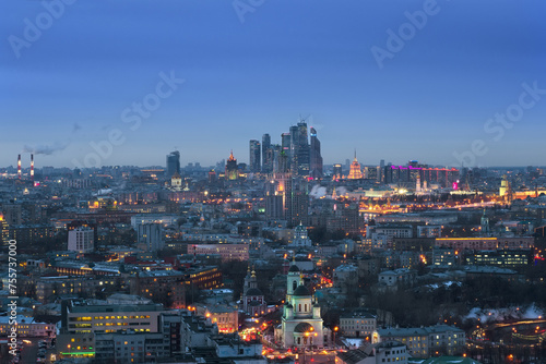 Panoramic view of Moscow City business complex, Stalin skyscrapers, residential buildings and churches at evening in Moscow, Russia