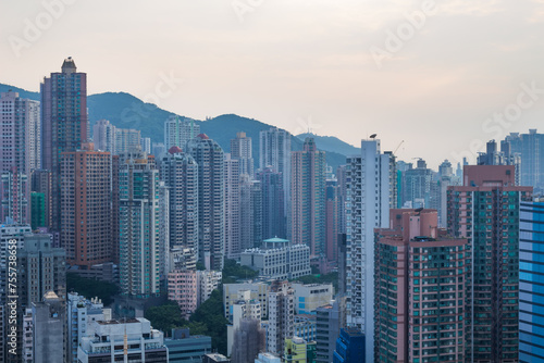 Skyscrapers and modern tall residential buildings and mountains in Hong Kong, China, view from China Merchants Tower
