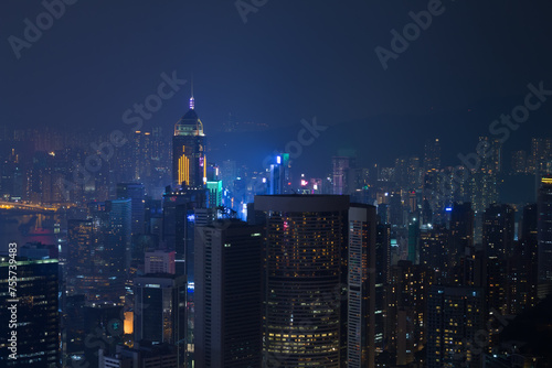 Photography Night skyscrapers with bright illumination and mountains in Hong Kong, China, vi