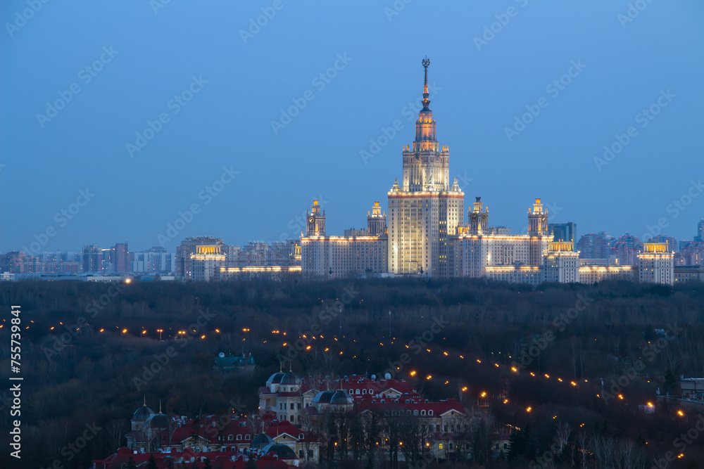Moscow State University and guest houses of Federal Security Service on Sparrow Hills at evening - one of Stalin skyscrapers at night, MSU building was built in 1953