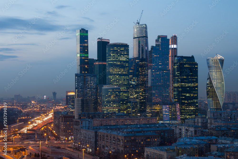  Futuristic Moscow International Business Center (MIBC) under construction at evening. East tower of complex Federation in height 374 m - highest skyscraper in Europe