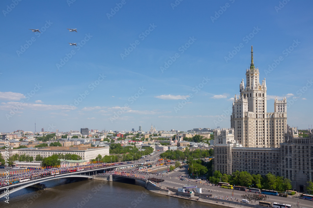 Obraz premium Three aircrafts fly during military parade on anniversary of Victory in World War II in Moscow, Russia