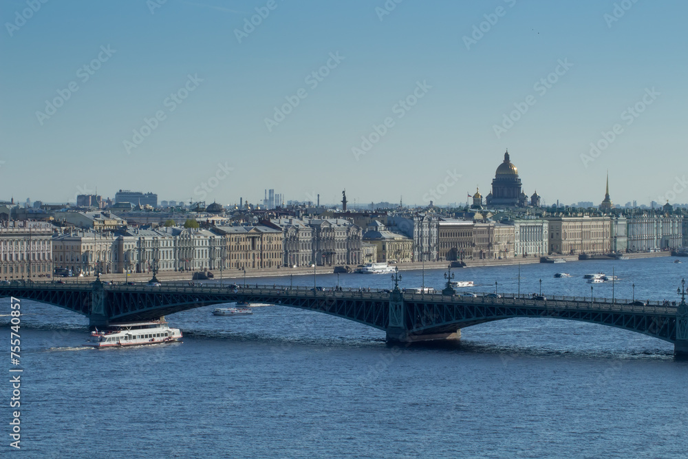 Fototapeta premium St. Isaac Cathedral, Palace Bridge, ships on Neva River in St. Petersburg, Russia