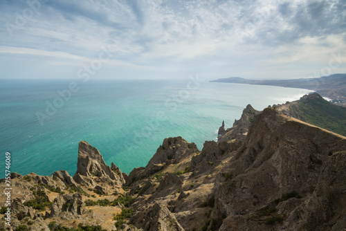 Beautiful rocks near sea waterside, skyline and blue water at summer day