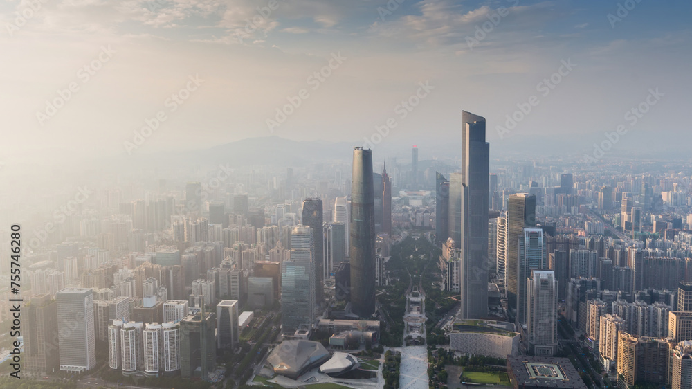 Guangzhou city panorama in fog during sunrise, China, aerial view