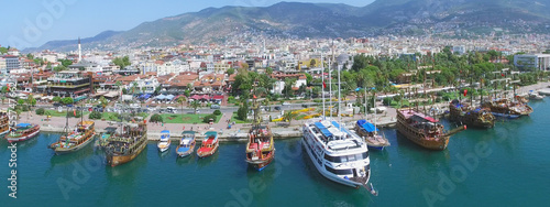 City panorama with Alania Sea Port at summer sunny day. Aerial view videoframe photo