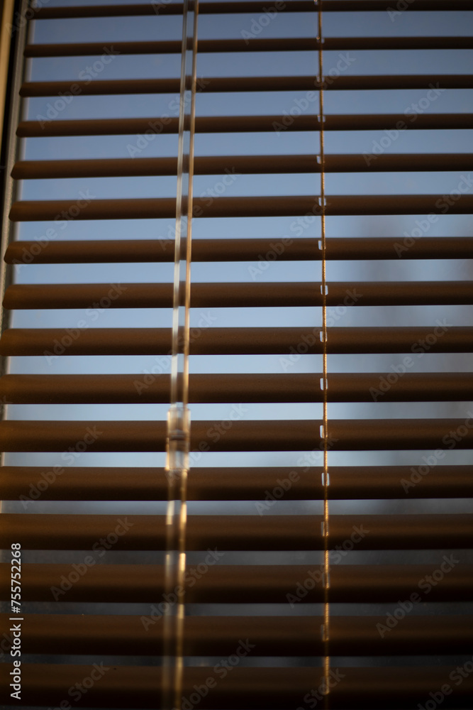 Light through the blinds. Window details. Interior of the apartment. Light through the blinds. Window details. Interior of the apartment.