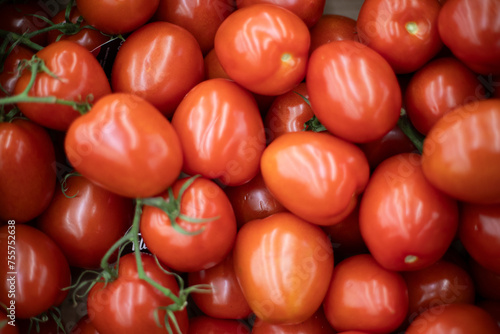 Red tomatoes. Vegetable texture. Tomatoes in the store. © Олег Копьёв