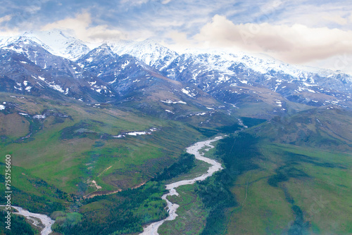 View of Alaskan Mountain Range and River in Valley