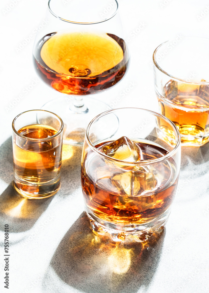 Strong alcohol drink. Cognac, whisky, rum, tequila at white background. Strong alcohol drink. Cognac, whisky, rum, tequila at white background.
