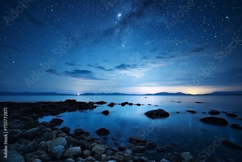 The atmosphere of the sea at night with many stars in the sky.