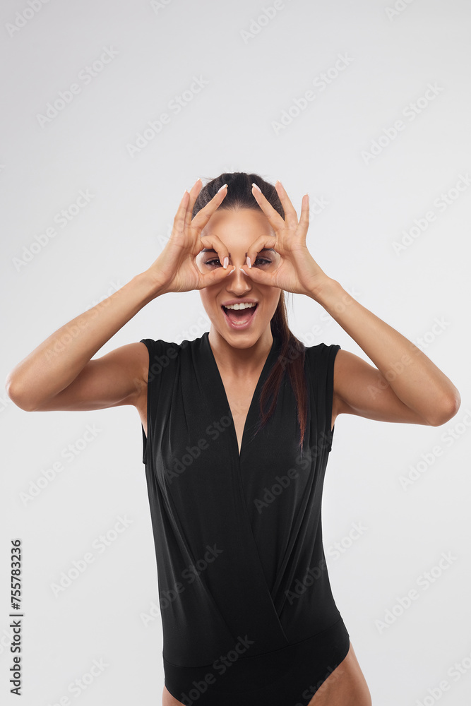 Close-up of carefree beautiful woman, close eyes and laughing from happiness, standing over white background Close-up of carefree beautiful woman, close eyes and laughing from happiness, standing over white background
