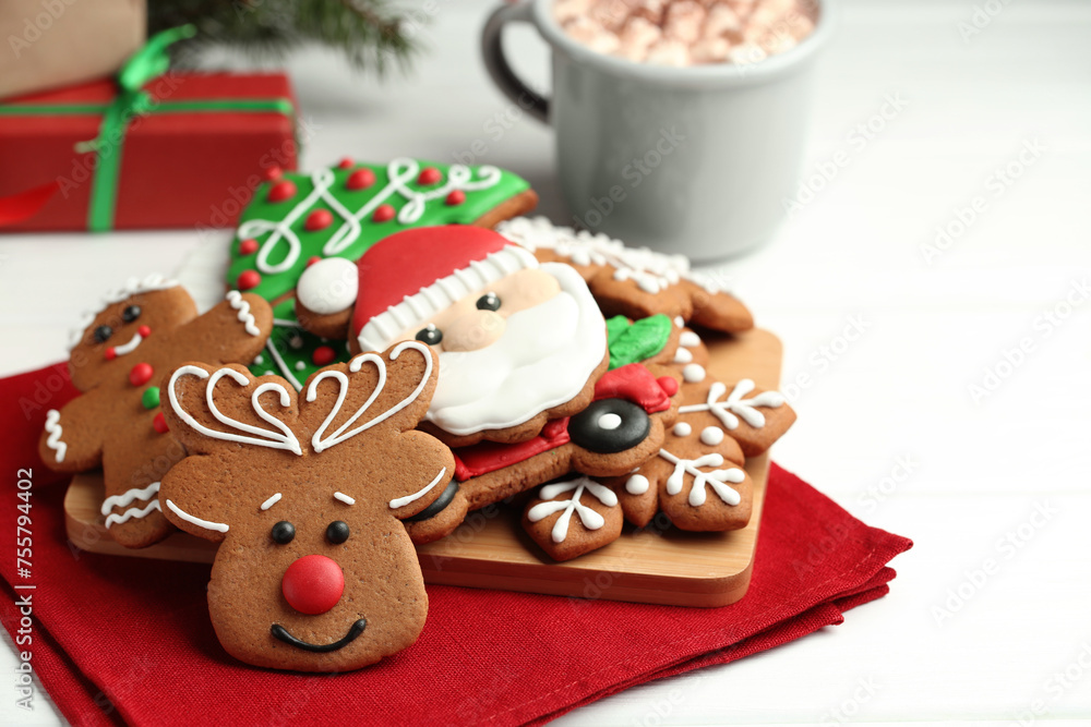 Fototapeta premium Tasty homemade Christmas cookies on white wooden table. Space for text