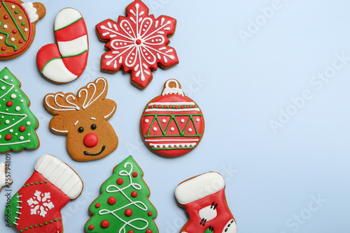 Different tasty Christmas cookies on light background, flat lay. Space for text