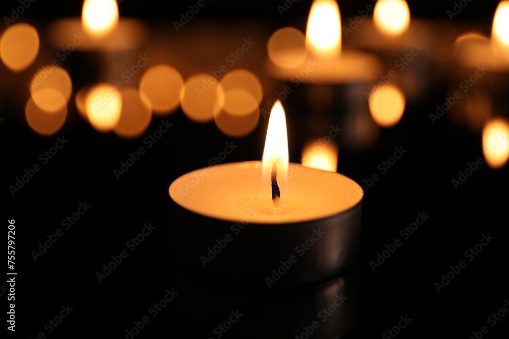Burning candle on dark surface. Memory day Burning candle on dark surface. Memory day