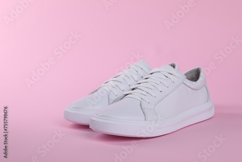 Wallpaper Mural Pair of stylish white sneakers on pink background Torontodigital.ca