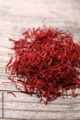 Aromatic saffron on wooden table, closeup view