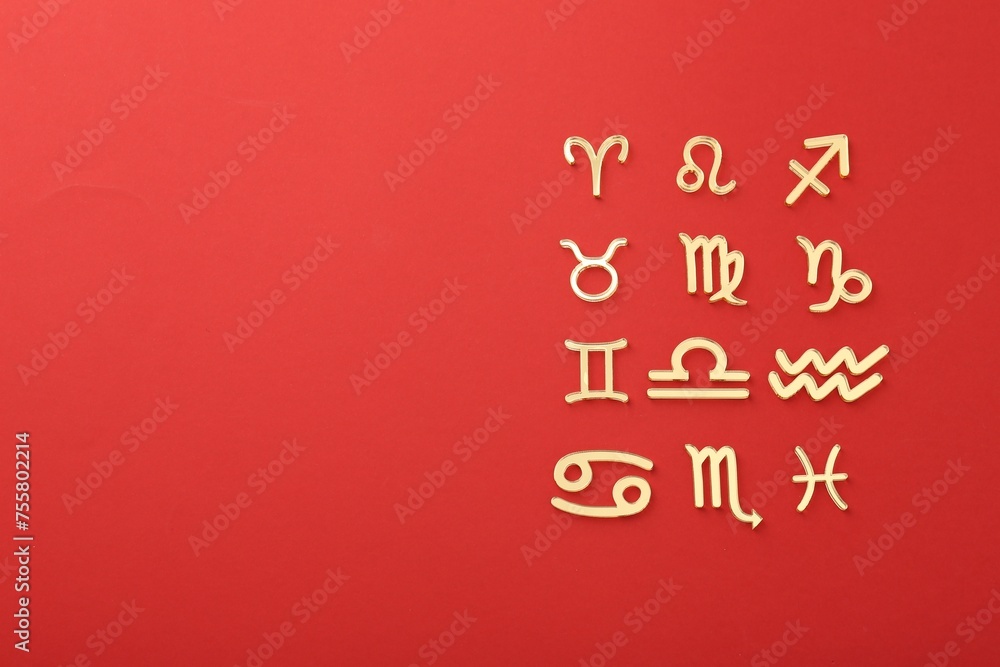 Zodiac signs on red background, flat lay. Space for text Zodiac signs on red background, flat lay. Space for text